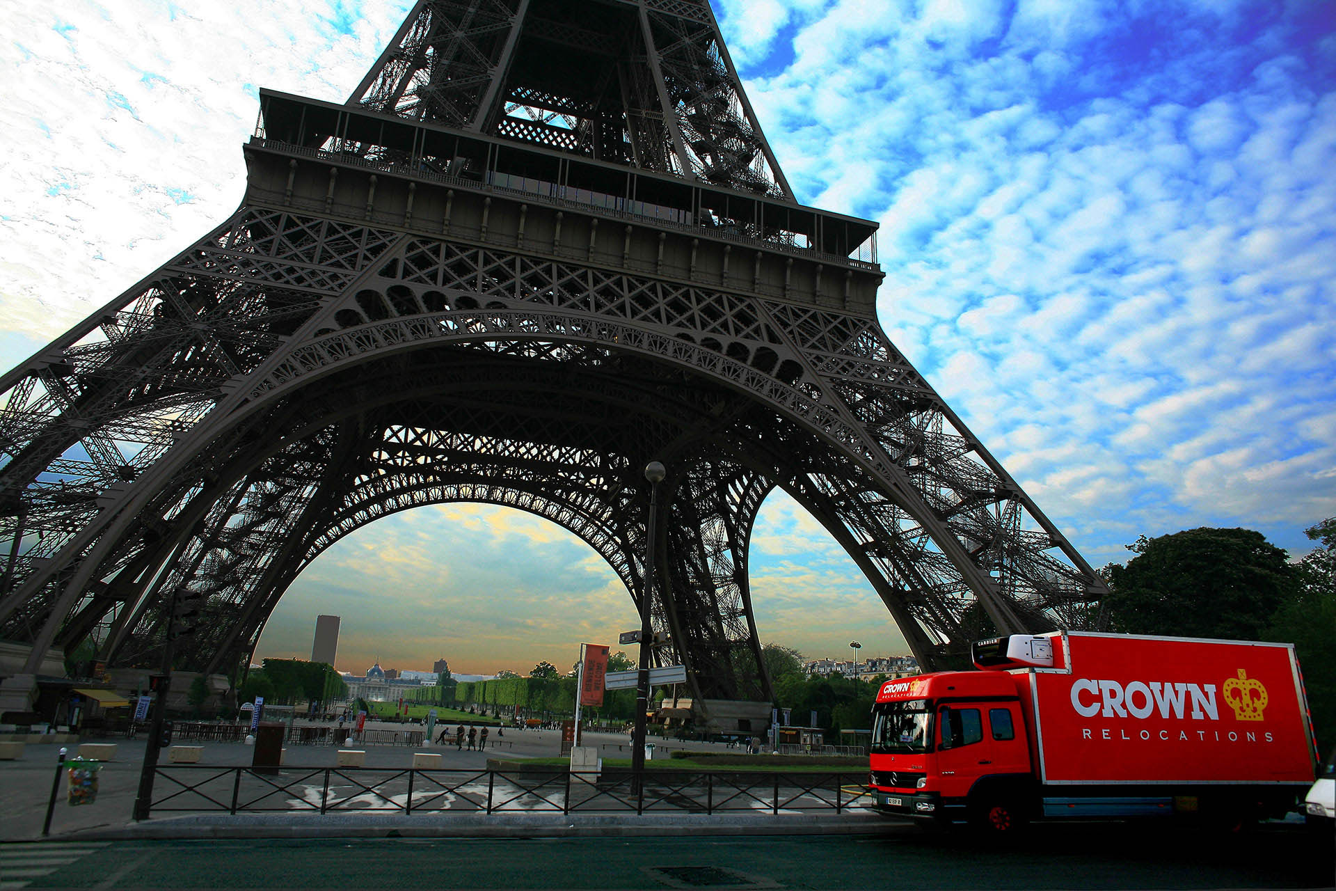Removal truck parked under the Eiffel Tower in Paris, France 